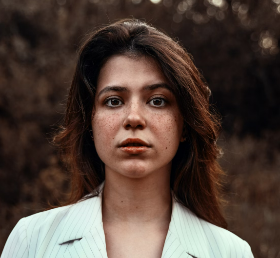Young woman with red hair outdoors